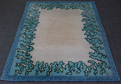 Lot 629 - A French modern wool rug of cream ground with...