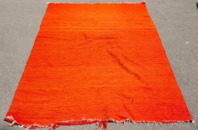Lot 635 - A hand woven Bedouin camel hair rug, in vivid...