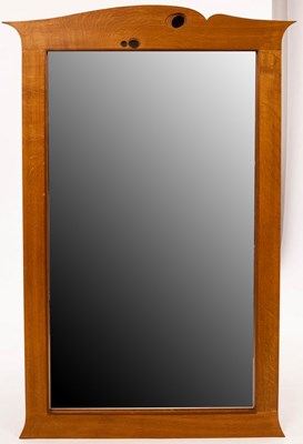 Lot 643 - An oak framed mirror of modern design, the...