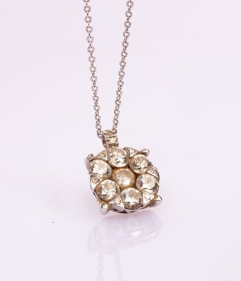 Lot 7 - A diamond flowerhead pendant, the seven-stone...