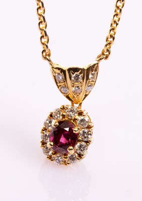 Lot 8 - A ruby and diamond cluster pendant necklace,...