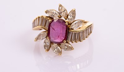 Lot 21 - A ruby and diamond dress ring, the central...