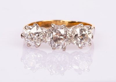 Lot 49 - A diamond three-stone ring, the three old...