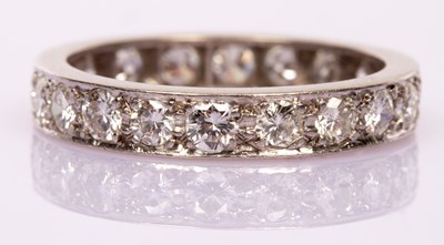 Lot 50 - A diamond eternity ring set with twenty...