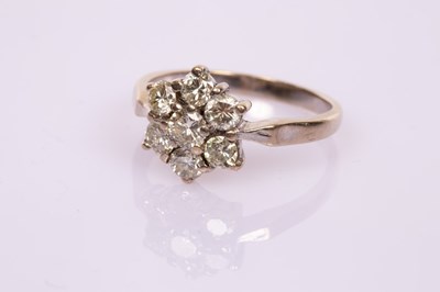 Lot 51 - A diamond seven-stone cluster ring set in 18ct...