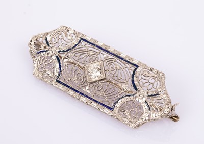 Lot 63 - An Art Deco diamond and 14k white gold brooch,...