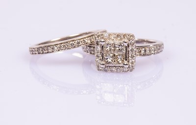 Lot 66 - A diamond dress ring of square cluster shape...