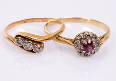 Lot 73 - A ruby and diamond cluster ring, set in 18ct...