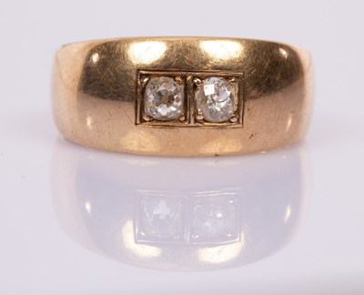 Lot 80 - A gentleman's diamond ring, the two diamonds...