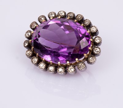Lot 81 - An amethyst and diamond brooch, the large oval...