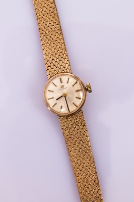 Lot 115 - A lady's gold cased Tissot wristwatch, the...