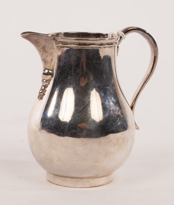 Lot 136 - A silver pear-shape cream jug, Arthur Martin...