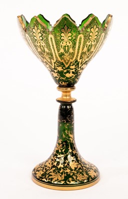 Lot 202 - A Victorian green glass vase, cut crenelated...