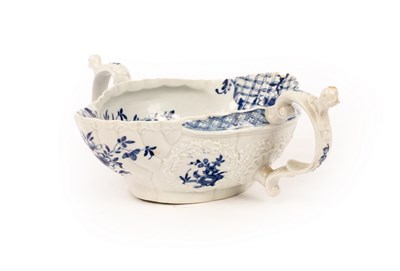 Lot 242 - A Worcester blue and white double-lipped sauce...