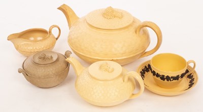 Lot 245 - Two Wedgwood caneware teapots, the covers with...