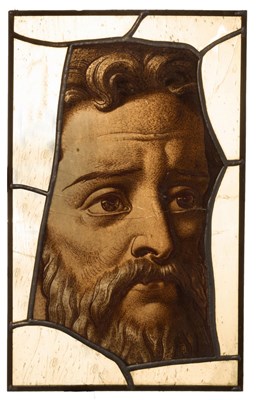 Lot 297 - A fragment of 17th Century stained glass, head...