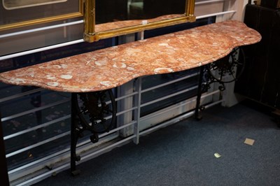 Lot 301 - A console table with marble top having iron...