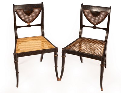 Lot 320 - A pair of Regency ebonised single chairs with...