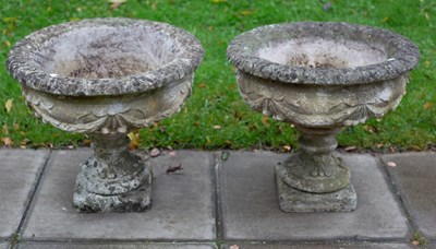 Lot 520 - A pair of reconstituted stone garden vases...