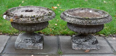 Lot 521 - A pair of squat reconstituted stone vases with...