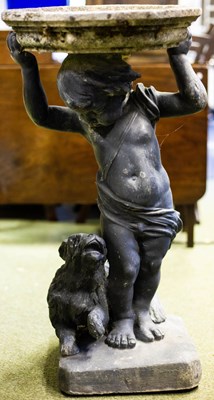 Lot 523 - A bird bath with lead putto and dog base, 76cm...