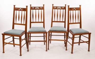 Lot 546 - A set of four Art Nouveau oak dining chairs,...