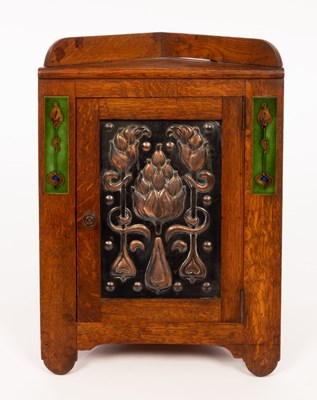 Lot 548 - An Art Nouveau oak, copper and enamel smokers...