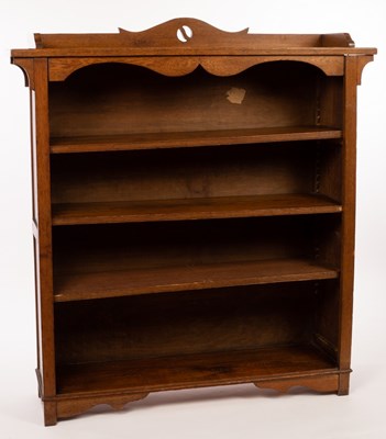 Lot 552 - An Arts & Crafts style oak bookcase with...