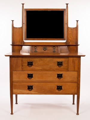 Lot 555 - An Art Nouveau oak dressing table, retailed by...