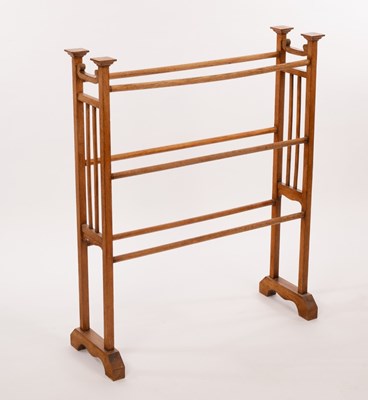 Lot 556 - An Arts & Crafts oak towel rail, 79cm wide