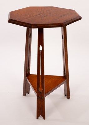 Lot 557 - An Arts & Crafts style oak occasional table,...