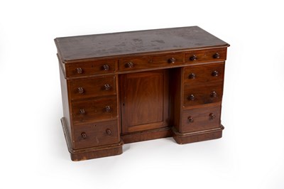 Lot 570 - A mahogany kneehole desk fitted a surround of...