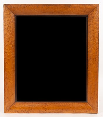 Lot 578 - A rectangular wall mirror with bevelled plate...