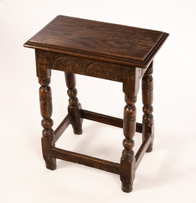 Lot 600 - A carved oak joint stool, on baluster turned...