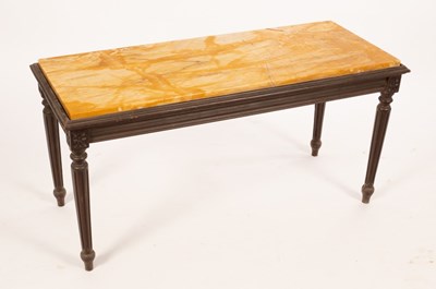 Lot 617 - A rectangular marble top table with ebonised...