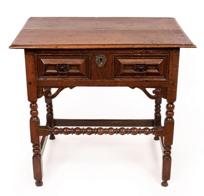 Lot 620 - A Charles II Guernsey oak side table with...