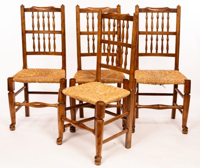 Lot 622 - Four ash spindle back chairs with rush seats...