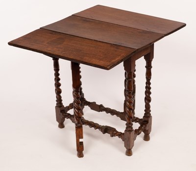 Lot 623 - A rectangular oak gateleg table on spiral...