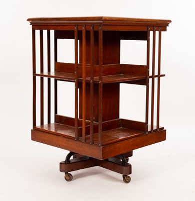 Lot 648 - An Edwardian walnut revolving bookcase with...