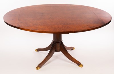 Lot 658 - A burr walnut square, four flap dining table,...