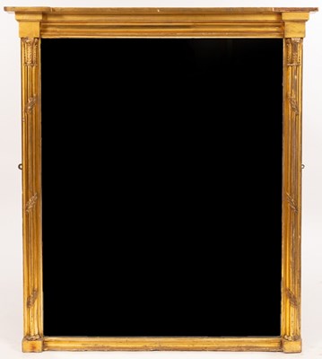 Lot 671 - A carved giltwood wall mirror, the shaped...