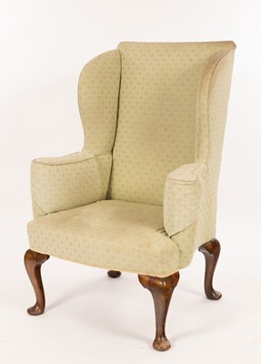 Lot 672 - A Queen Anne style wing armchair with...