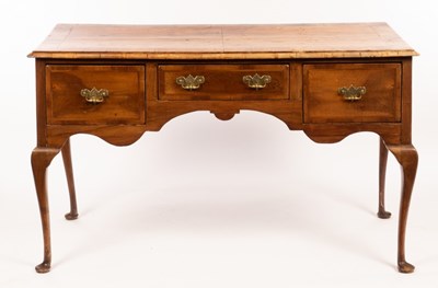 Lot 701 - A walnut side table fitted three drawers, on...