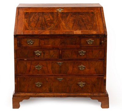 Lot 705 - A George I walnut bureau, cross banded and...