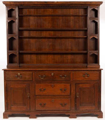 Lot 755 - A 19th Century oak dresser, the closed rack...