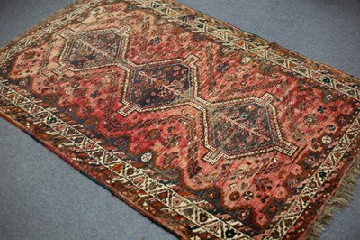 Lot 779 - An Eastern rug, the crimson ground with triple...