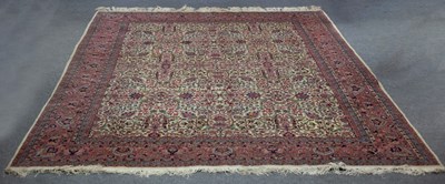 Lot 781 - An Eastern rug of aubergine ground decorated...