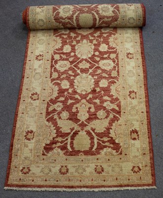 Lot 793 - A modern runner, 314cm x 80cm, a Bokhara rug,...