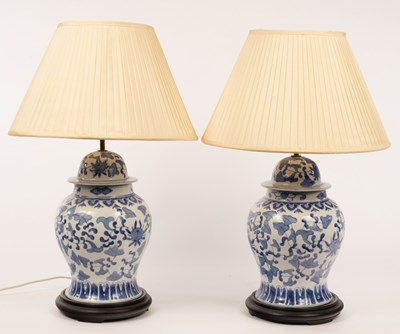 Lot 812 - A pair of Chinese style blue and white lamps,...