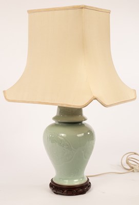 Lot 813 - A Chinese style celadon lamp, 72cm high...